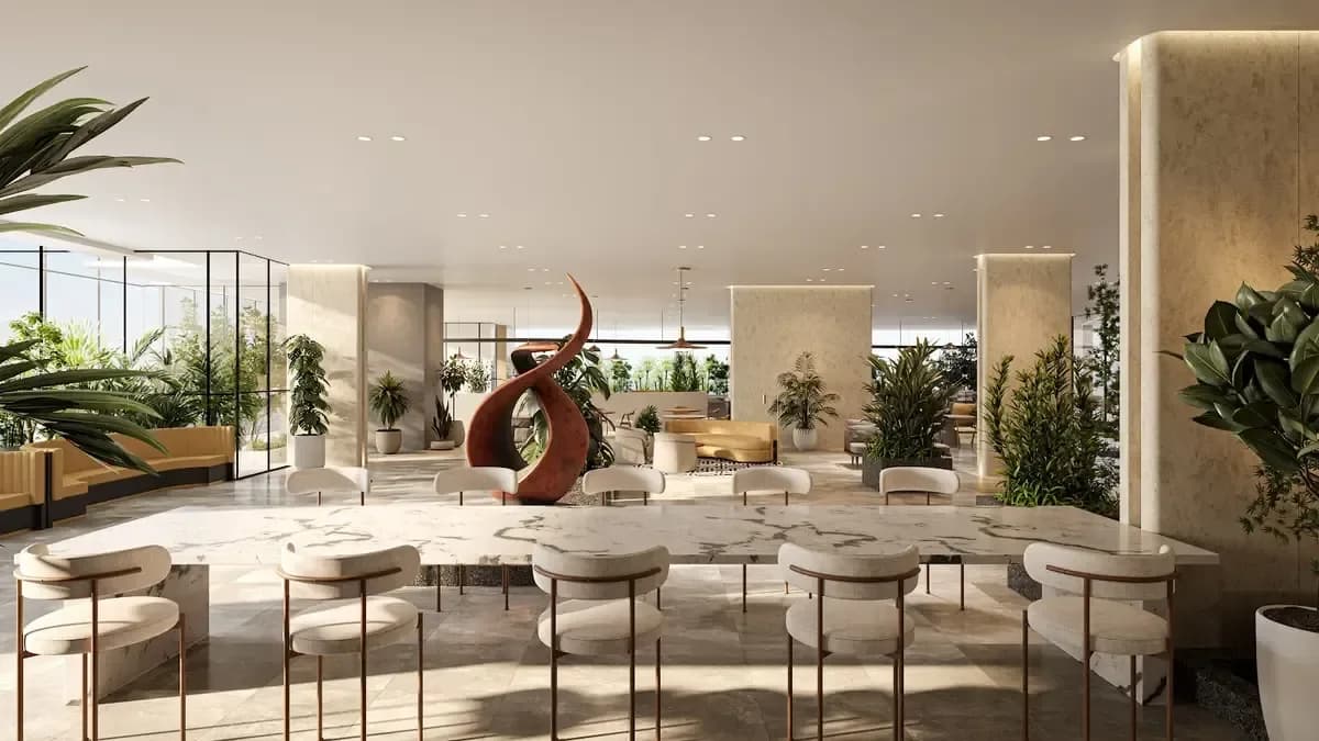 Landscaped lobby with lounge seating and a sculpture